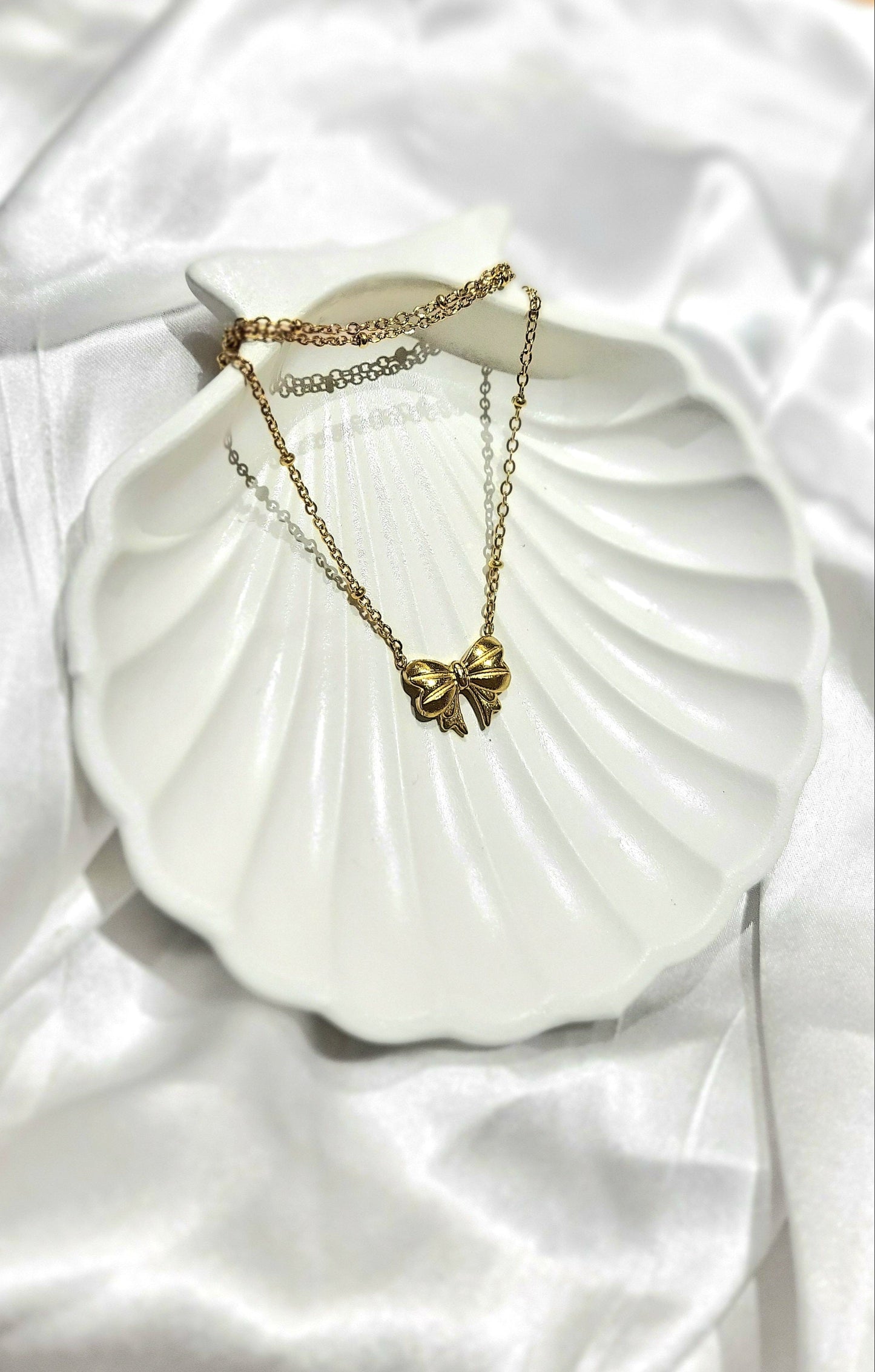 CHARM KNOT NECKLACE